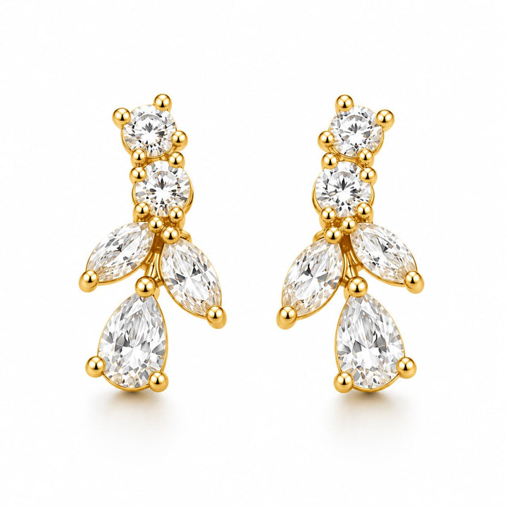 A pair of gold drop earrings featuring clear round and marquise-cut gemstones, displayed on a clean white background.