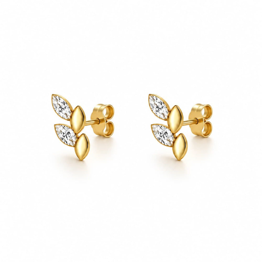 A pair of gold leaf stud earrings with marquise-cut clear stones, shown on a clean white background.