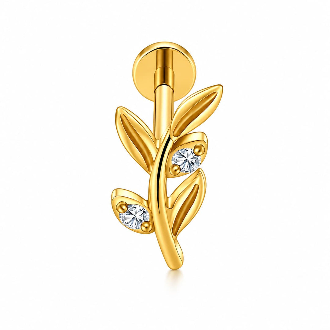A gold leaf-shaped body jewelry piece with two clear round-cut gemstones, shown on a clean white background.