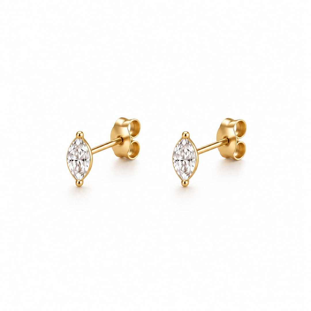 Round earrings with a metallic finish on a white background