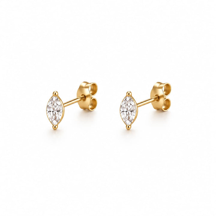 Round earrings with a metallic finish on a white background