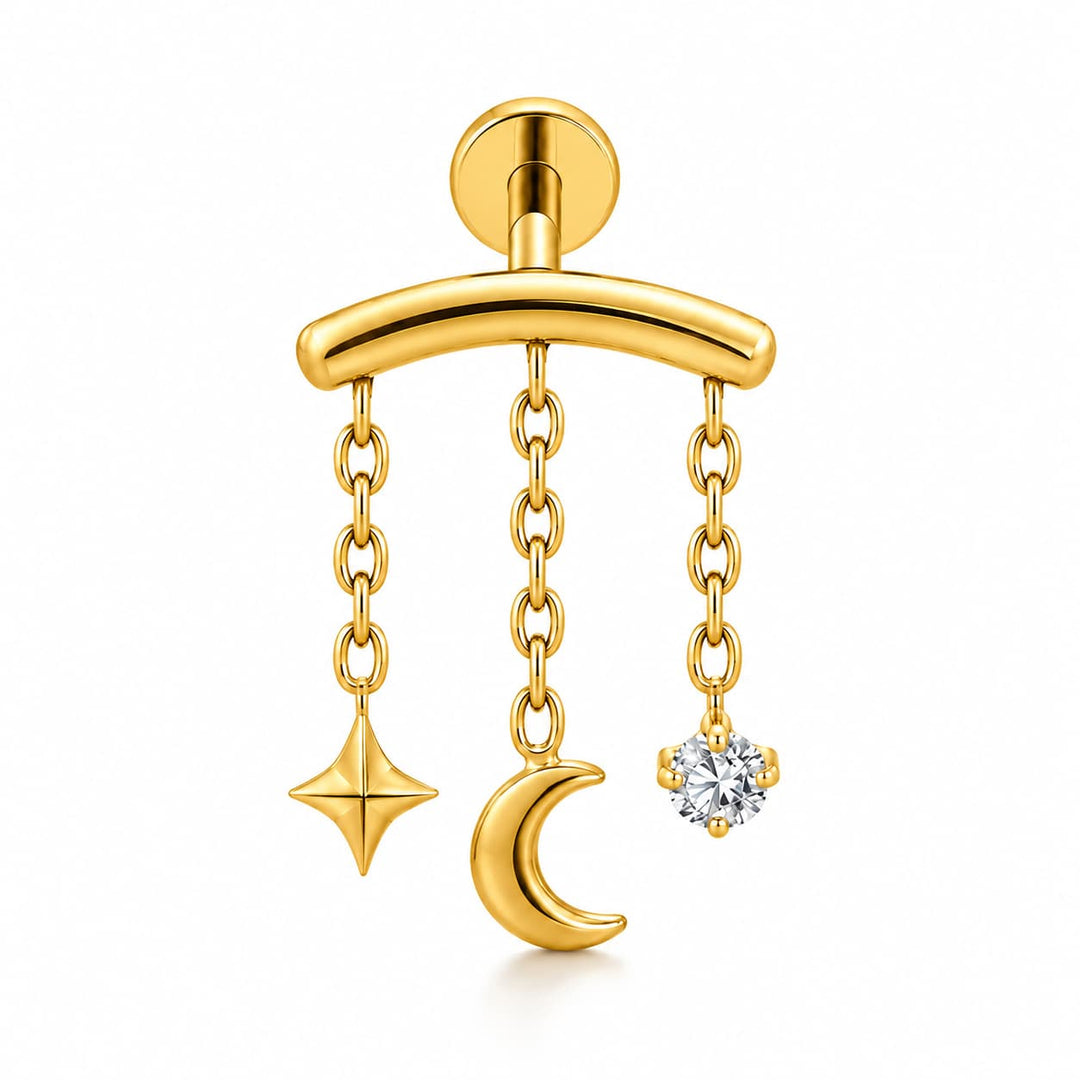 A gold-toned barbell earring with three dangling charms: a star, a crescent moon, and a round clear gemstone, shown on a clean white background.