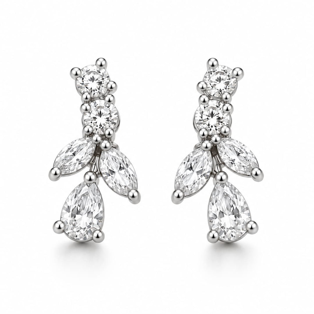 A pair of silver-tone drop earrings featuring clear gemstones in a floral cluster design, photographed on a clean white background.