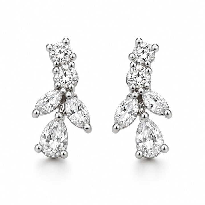 A pair of silver-tone drop earrings featuring clear gemstones in a floral cluster design, photographed on a clean white background.