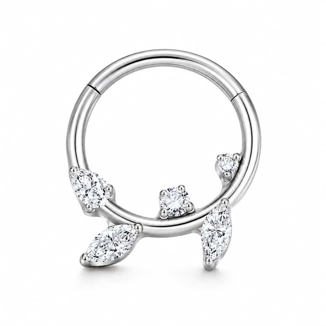A silver-toned circular hoop piercing ring decorated with four clear marquise and round-cut gemstones, shown on a clean white background.