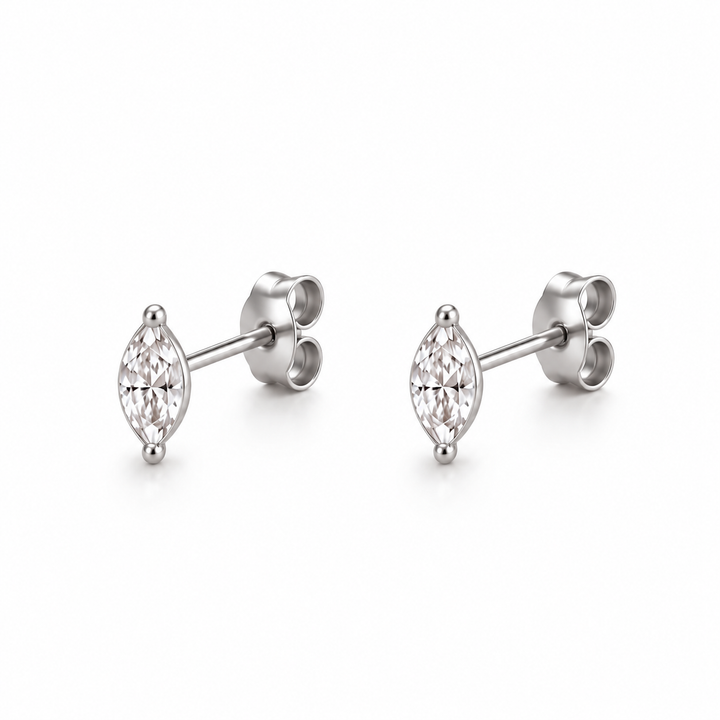 A pair of silver stud earrings with marquise-cut clear gemstones, shown from a side angle on a clean white background.