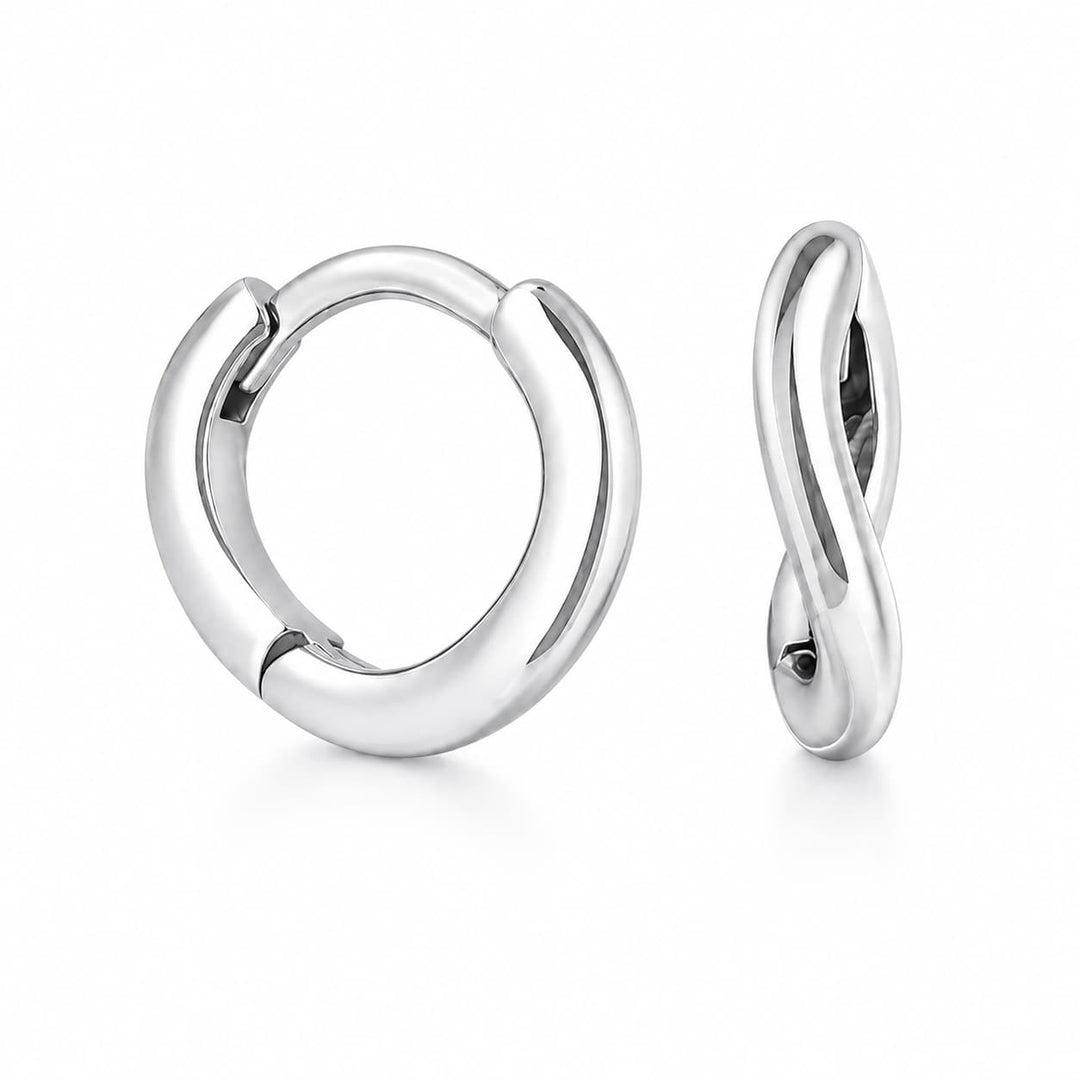 A pair of polished silver huggie hoop earrings, one shown from the front and the other from the side profile, on a clean white background.