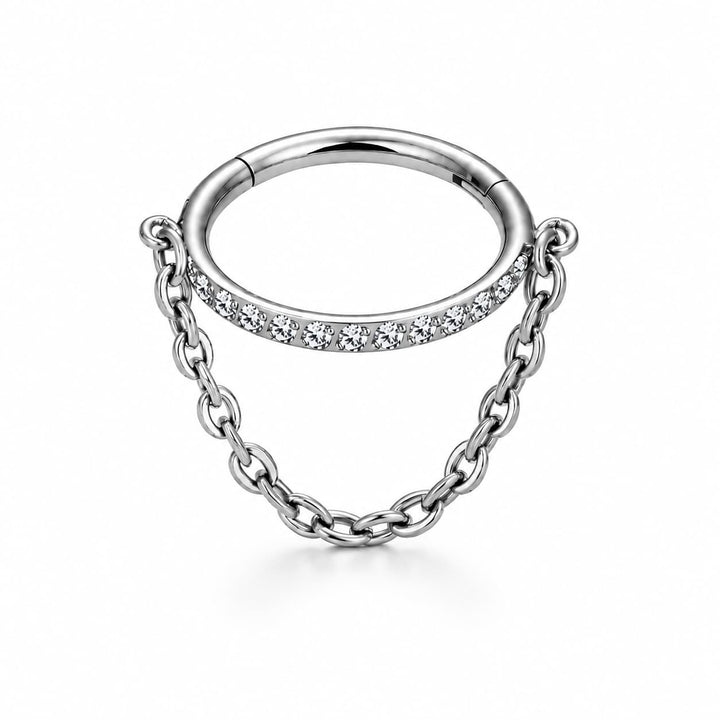 A silver ring with a small curved chain dangle. The top of the chain is embellished with a row of clear cubic zirconia stones, set against a clean white background.