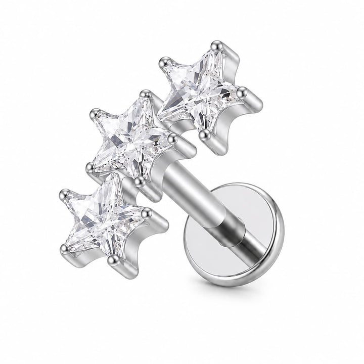 Silver-toned labret piercing stud with three clear faceted star-shaped gemstones on a white background.